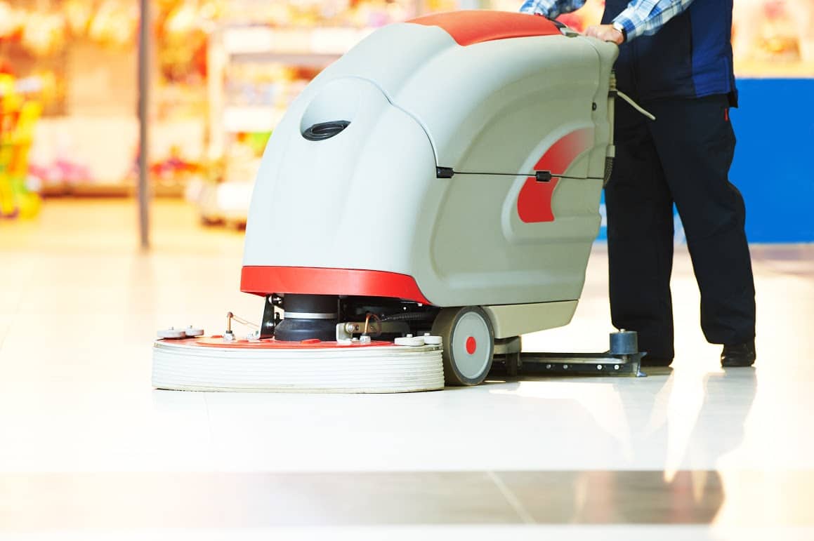 Floor care and cleaning services with washing machine in supermarket shop store